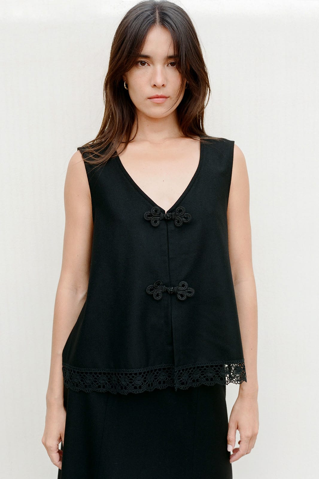 arkitaip Tops The Marie Sleeveless Wool Vest in black with lace trim